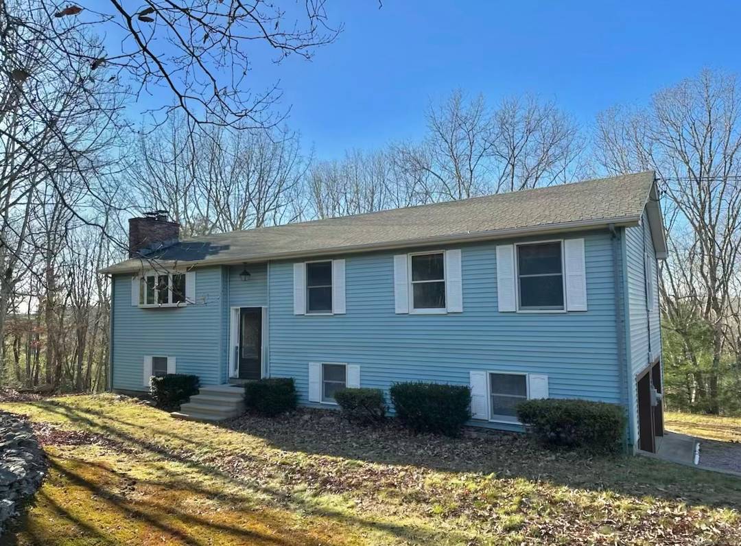 Welcome to this beautifully 3 bedroom, 3 bathroom raised ranch set on 5.