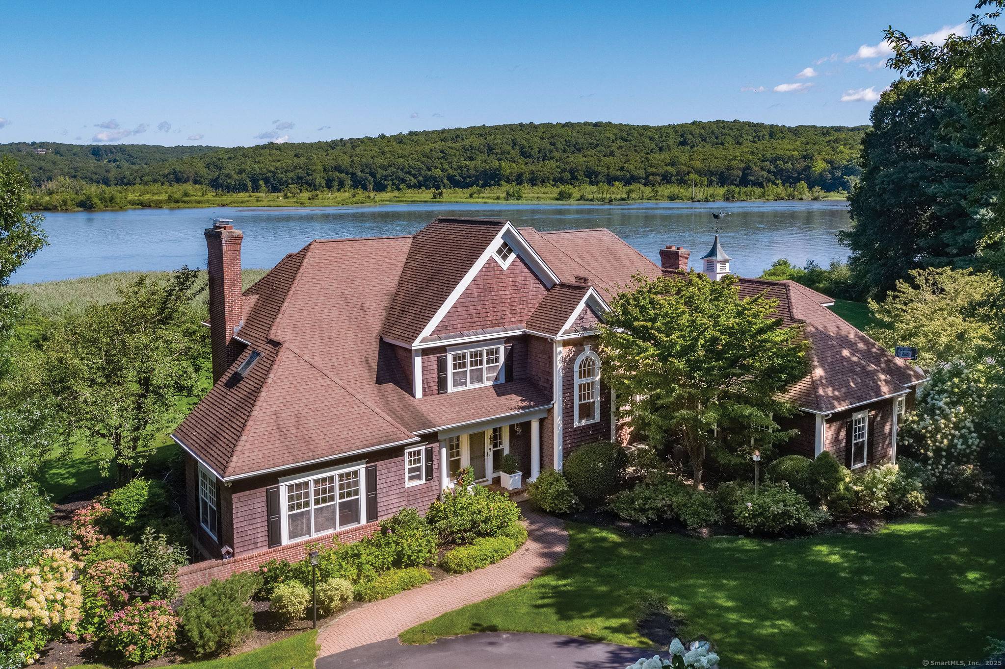 Rare opportunity to own this gorgeous waterfront estate on the prestigious River Road.