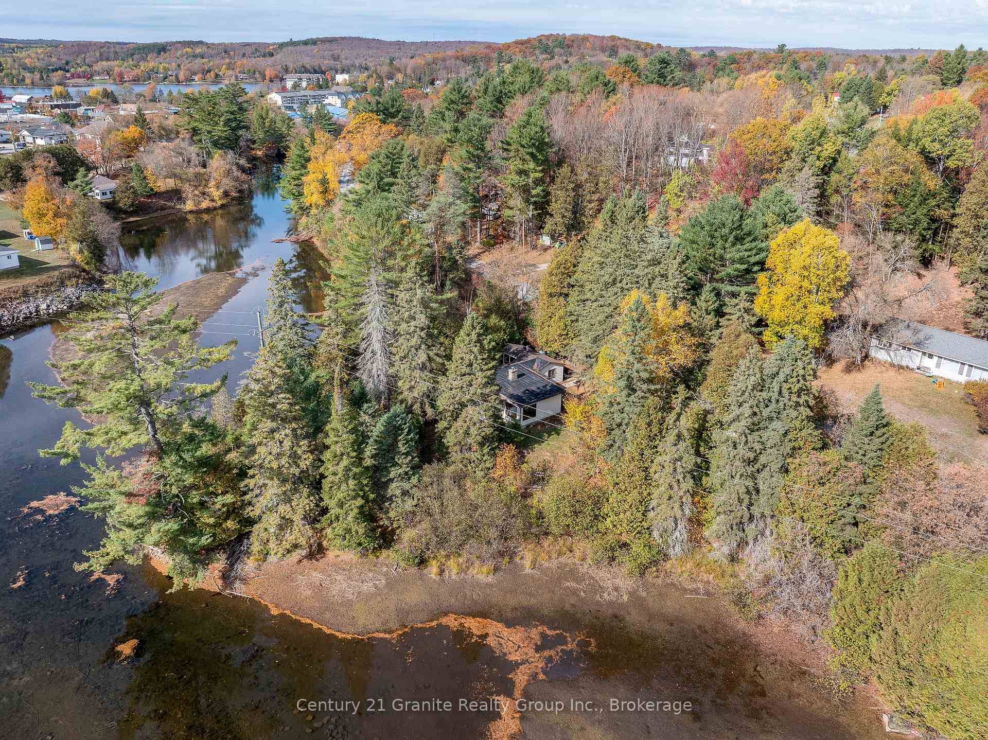 Charming In Town Riverside Retreat in Haliburton Village Discover this unique in town point lot offering over 150 feet of serene frontage on the Drag River.