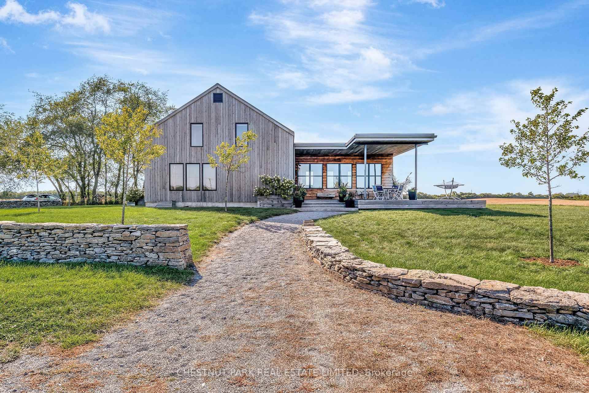 Nestled in the rolling hills of Hillier, 1164 Danforth Road is a modern country retreat where design and nature are in perfect harmony.