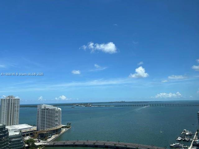 Enjoy stunning Direct Unobstructed water views from this 3 2 corner unit, Carbonized bamboo floors throughout NO CARPET, open Italian kitchen, S.