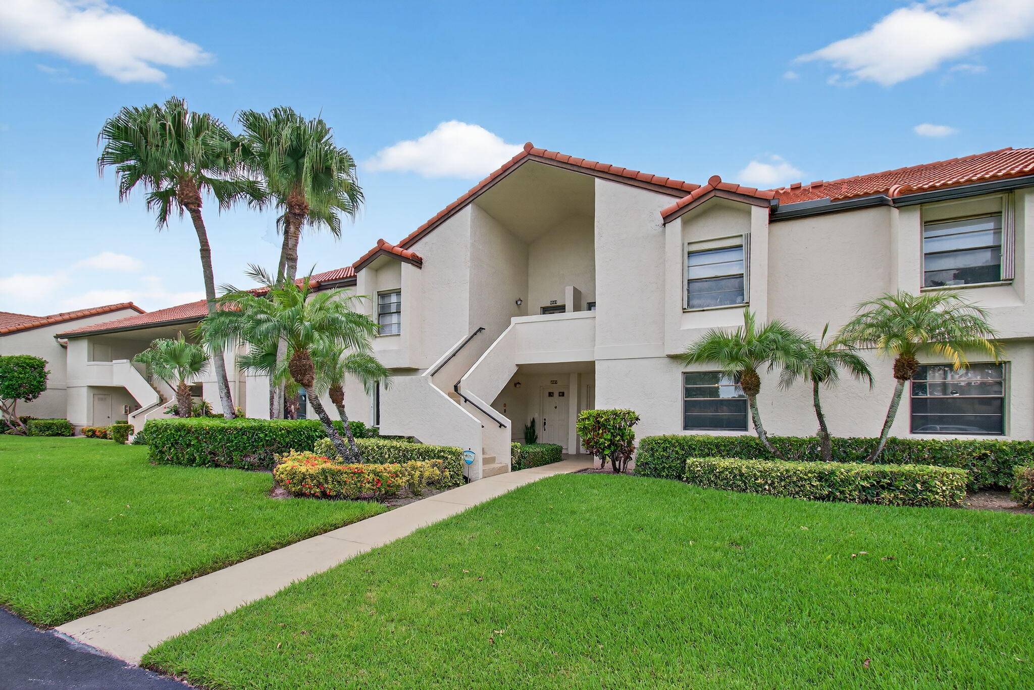 Rarely available 1st floor corner unit with serene lake views.