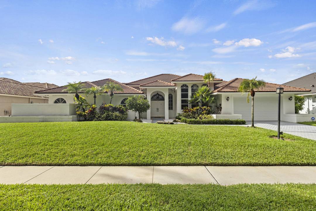 Magnificent 5BR 3BA pool home in Stonebridge CC in Boca Raton, offering golf exclusive country club lifestyle.