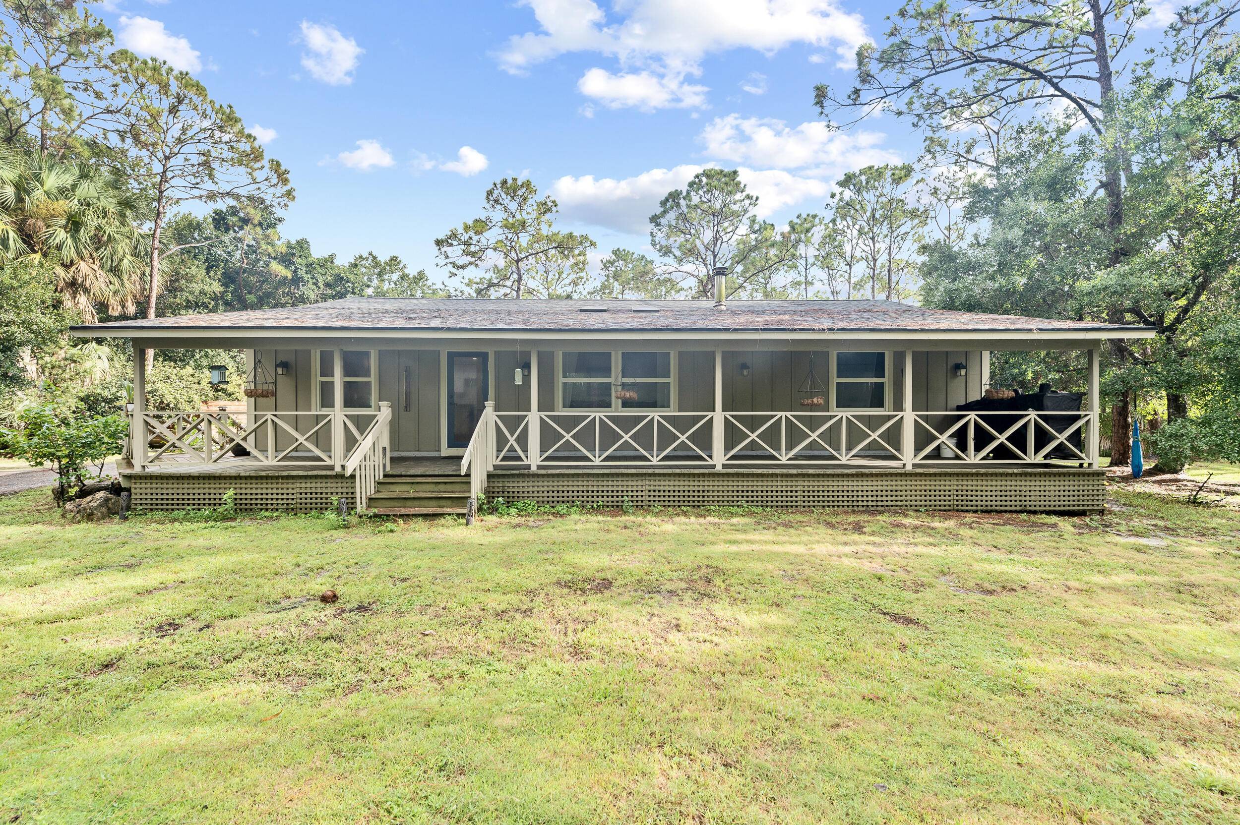Set on 1. 35 fully gated acres, this renovated 3 bed, 2 bath farmhouse retreat greets you with a wrap around porch and bright, timeless interiors refreshed in 2023 with ...