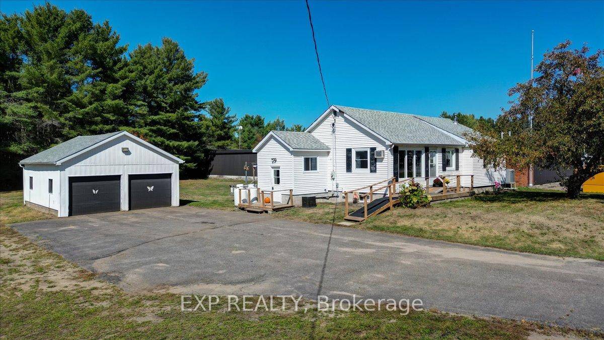 Charming Bungalow with Trail Access and Detached Garage.