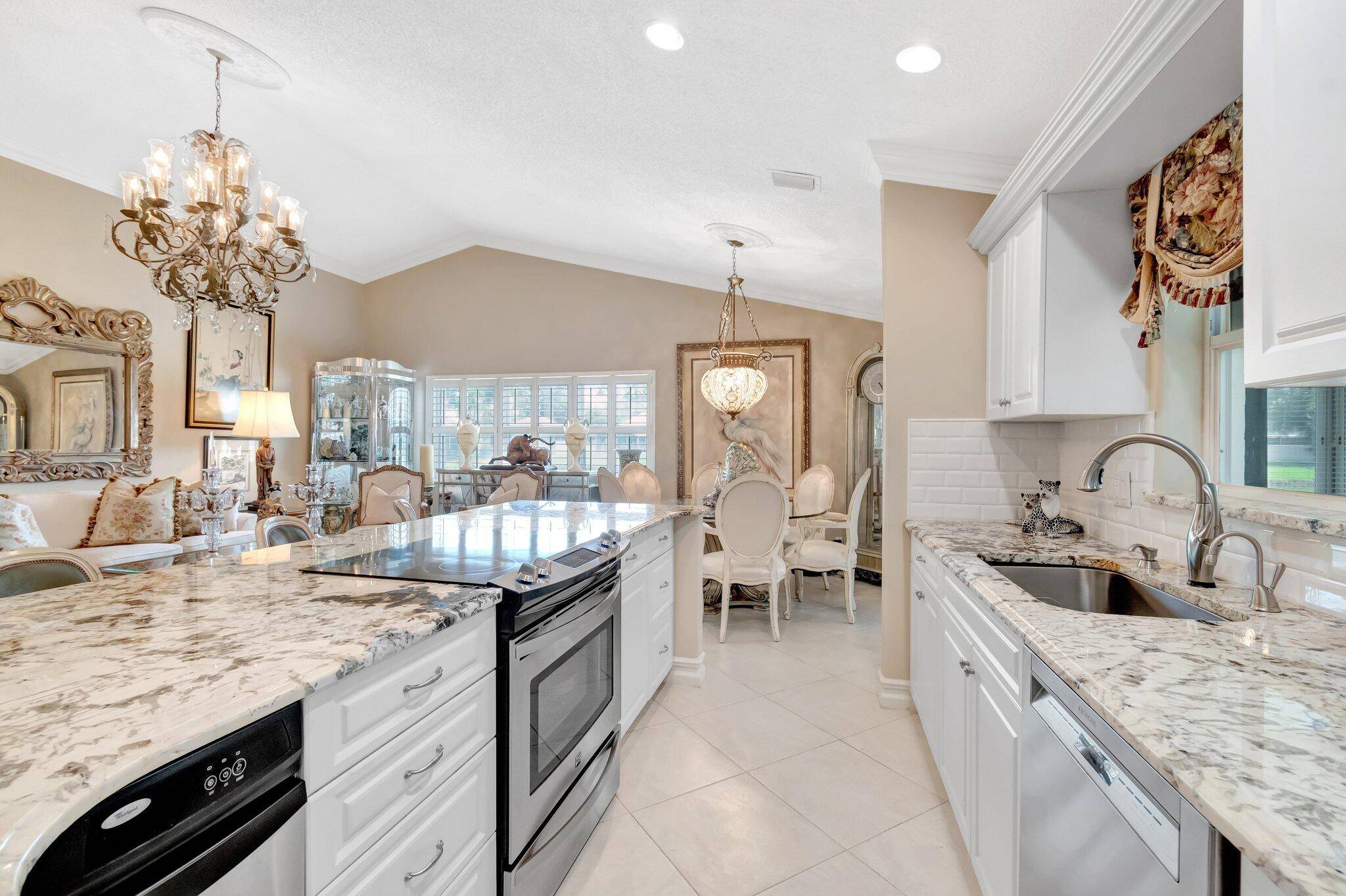 ELEGANCE AWAITS ! STEP INTO THIS WONDERFUL LAKE FRONT 3BR 2BA W OPEN KITCHEN LAYOUT FEATURING LARGE BREAKFAST BAR, VOLUME CEILINGS.