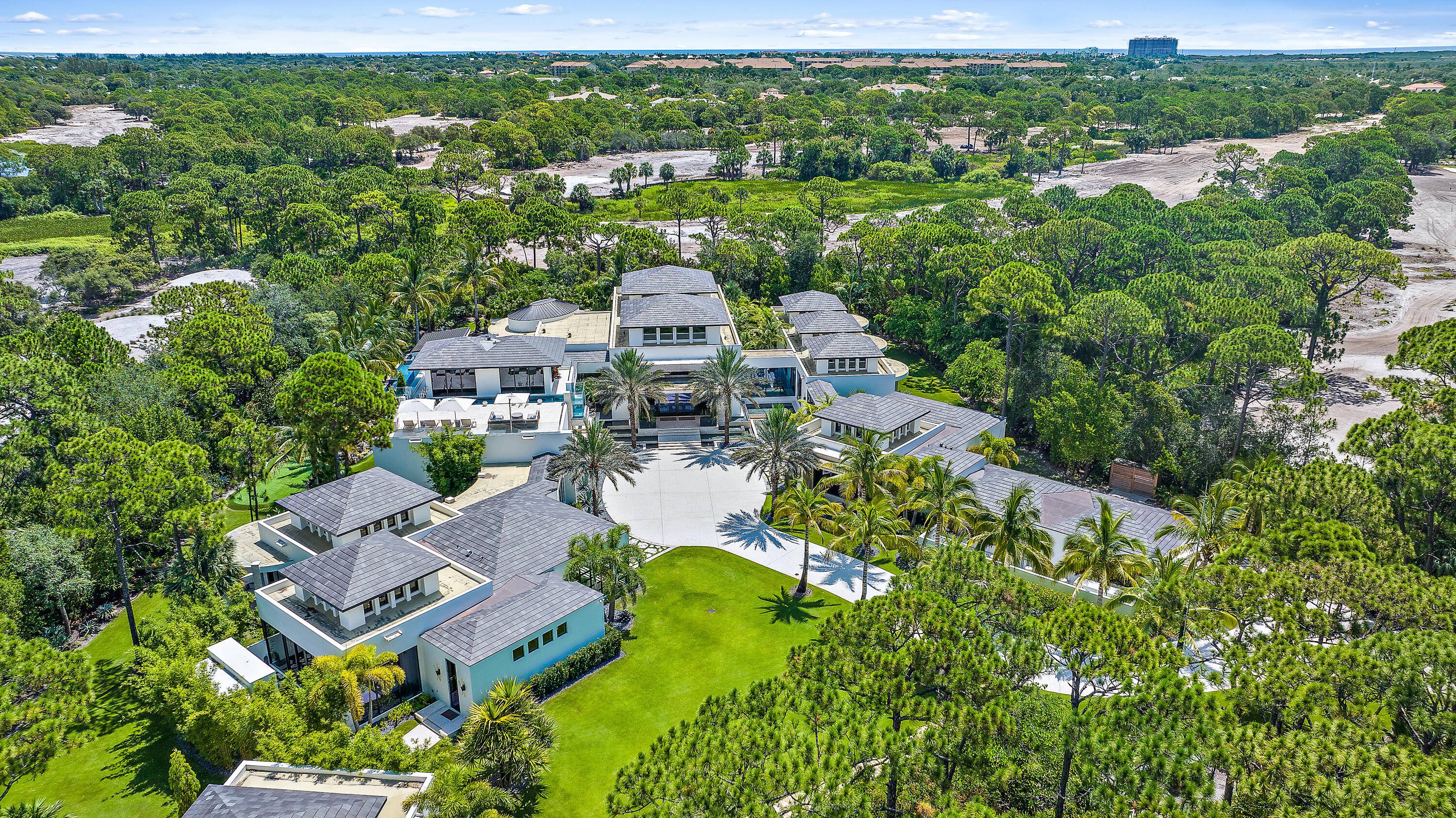 This 25, 500 SF resort style estate is privately positioned on a sprawling 2.