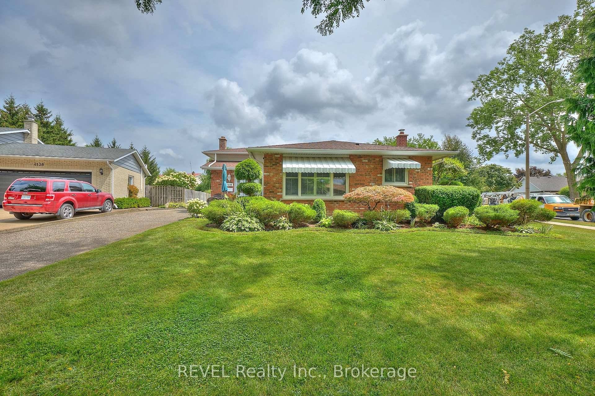 This 4 bedroom backsplit on a sunny corner lot feels like home the moment you arrive.