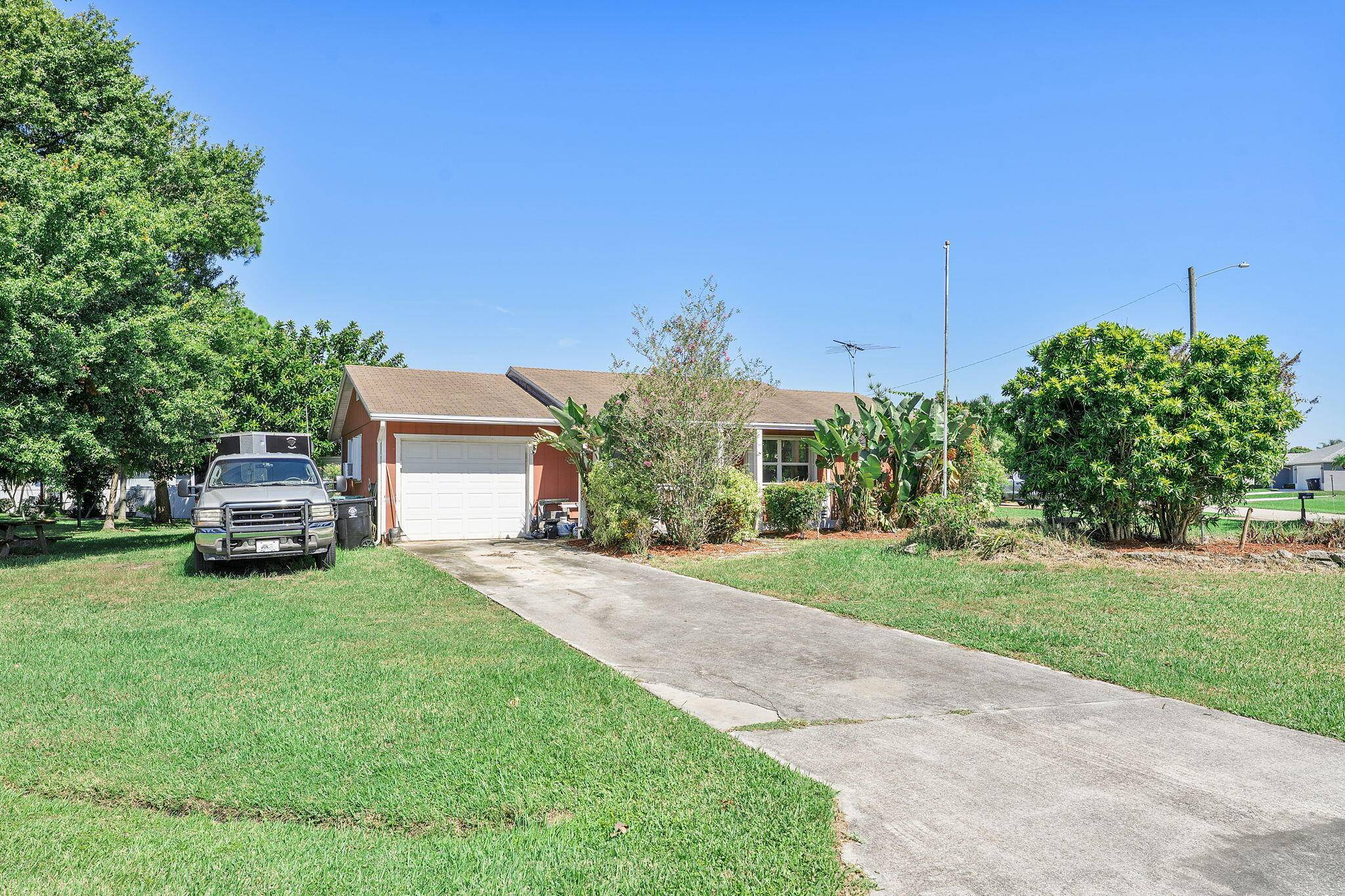 Welcome to this beautiful 3 bedroom, 2 bathroom single story home in a peaceful Port St.