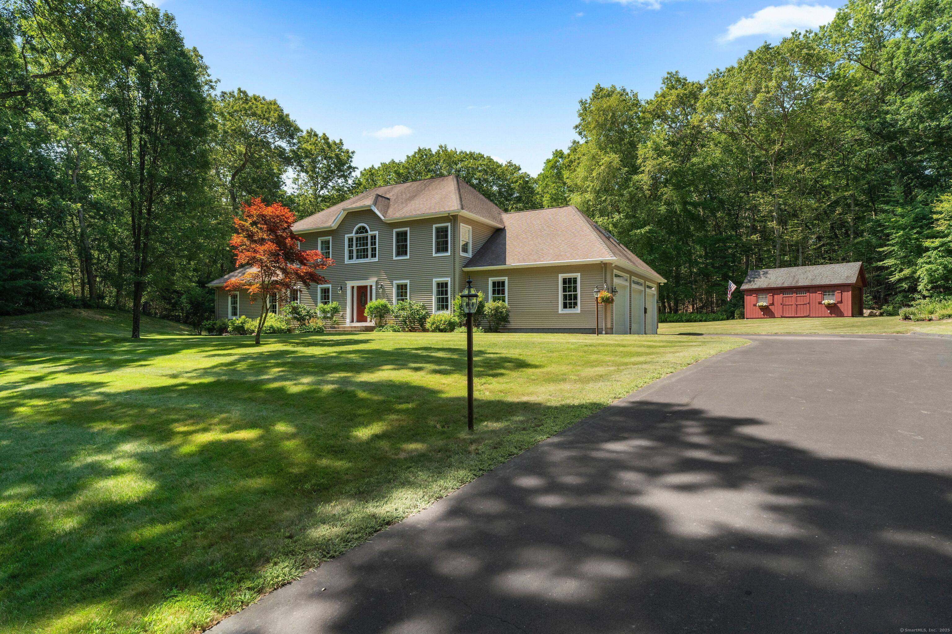 Set back from the road on a beautifully landscaped 2.