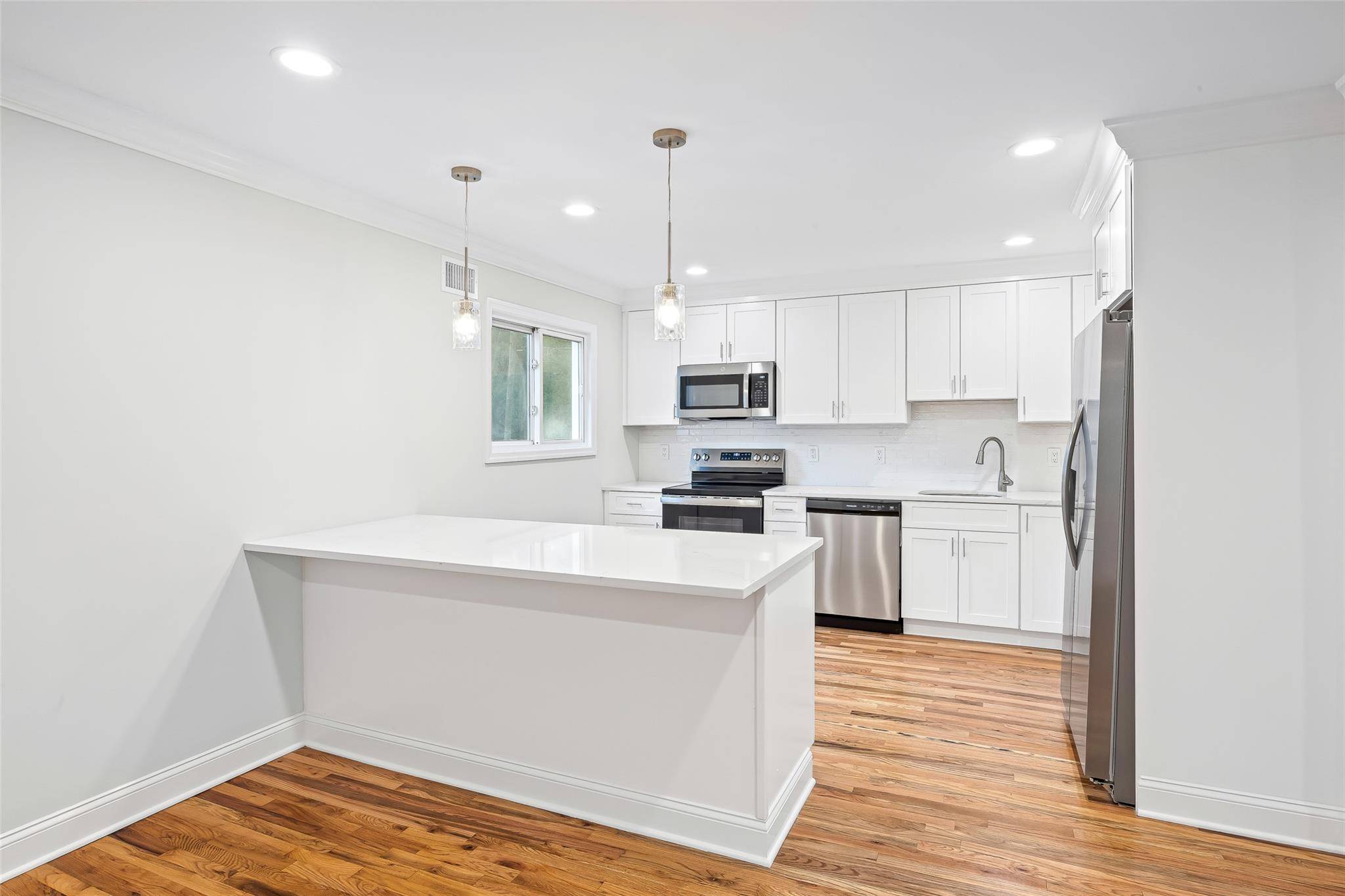 This beautifully updated and spacious home features stunning hardwood floors, generously sized bedrooms, and brand new, modern appliances.