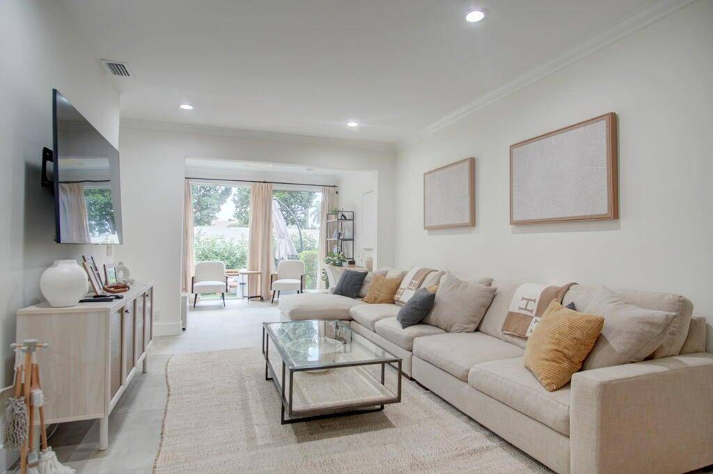 Stunning, spacious townhome, offering over 2, 000 sq ft of elegant living space in the prestigious gated community of Boca Pointe.