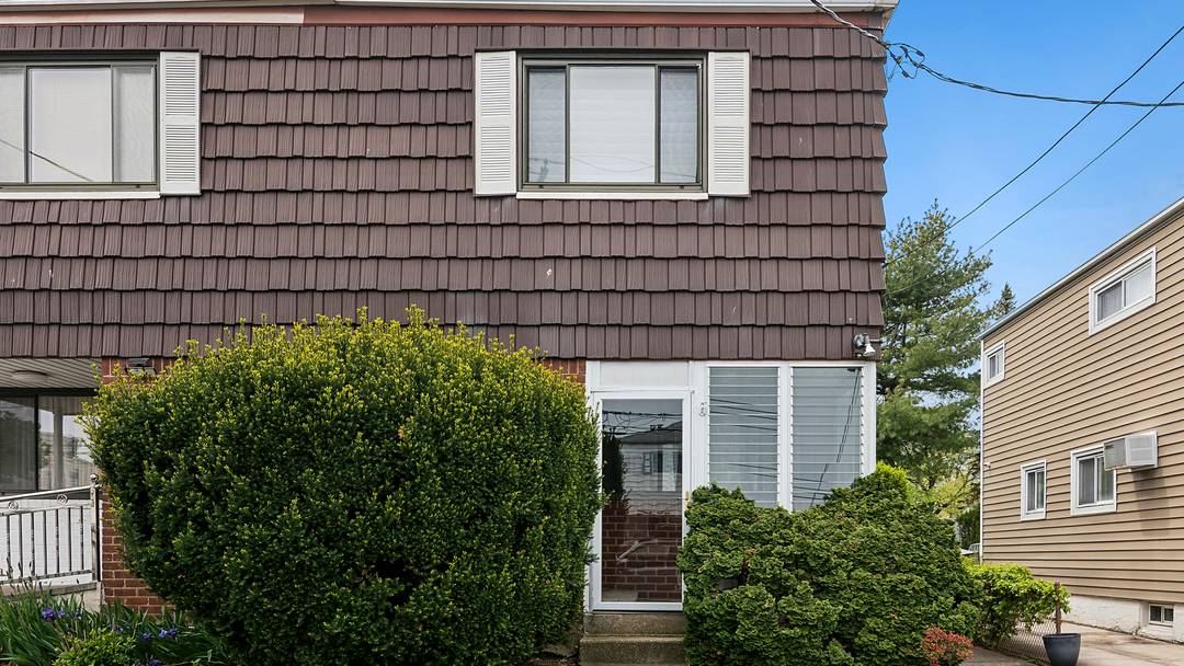 Welcome to this well maintained semi attached home, beautifully set on a quiet, tree lined street in the heart of Kew Gardens Hills.