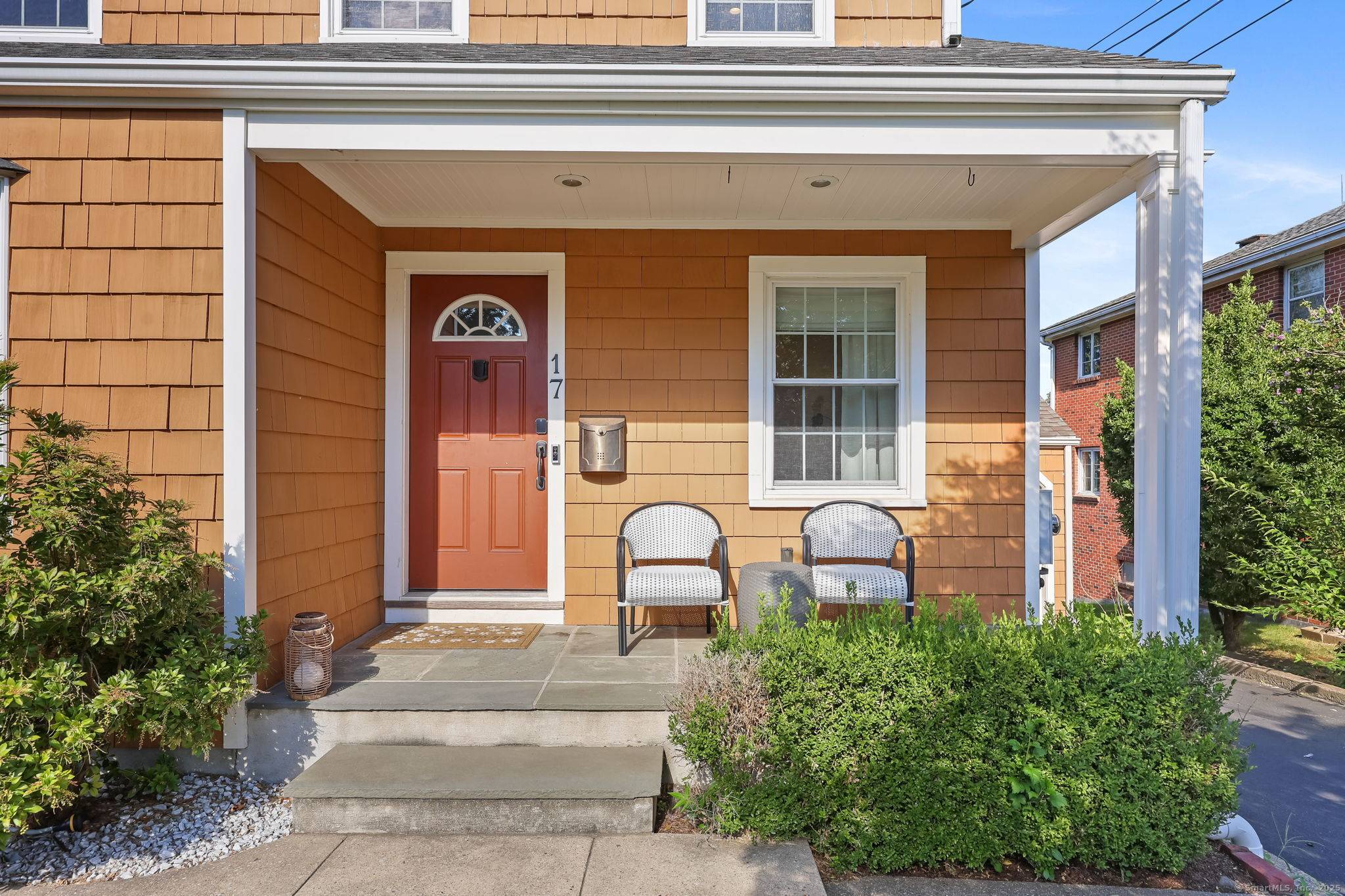 Charming Brookside cape with fully fenced in backyard and covered deck.