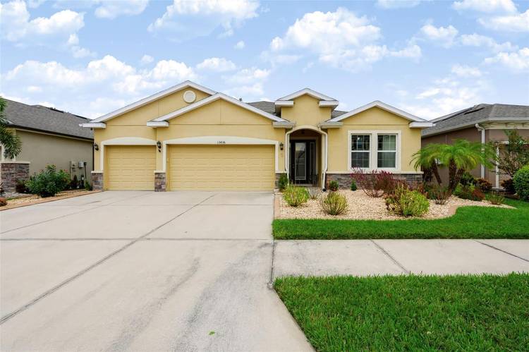 Welcome to this beautifully maintained four bedroom, three bathroom home in The Creeks at Citrus Park, a private gated community in Tampa.