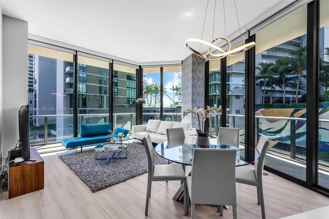 Beautifully furnished 3 bedroom, 2 bath corner residence at Paraiso Bayviews with 1, 152 SF of modern living space.