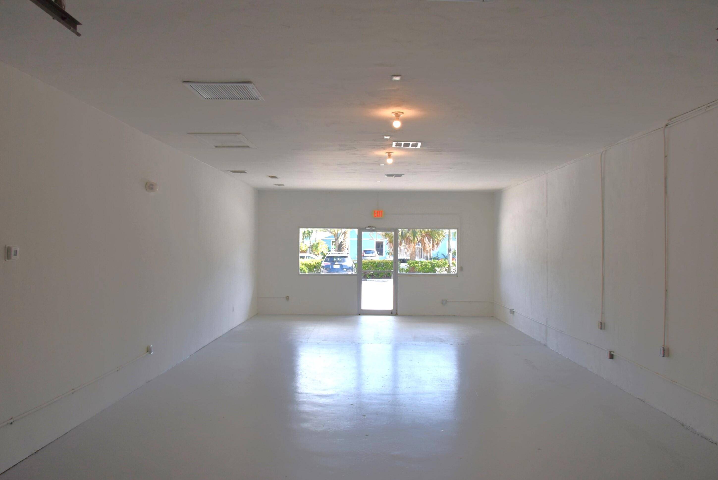 Newly renovated 962 SF end cap retail space with one 8' x 8' overhead door.
