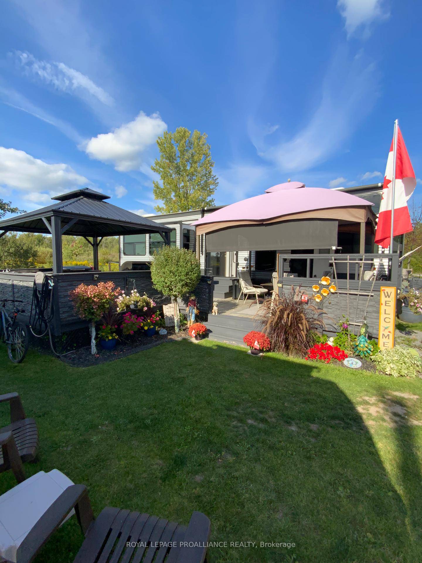 Welcome to 108 Boardwalk Ave, a Beautiful trailer home located on a canal that flows directly into the Trent River.