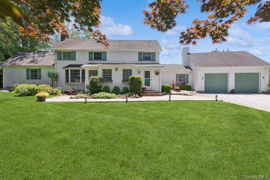 Nestled in a storybook setting where history, nature, and charm converge in this enchanting carriage house overlooking the serene waters of Mill Pond in Wading River.