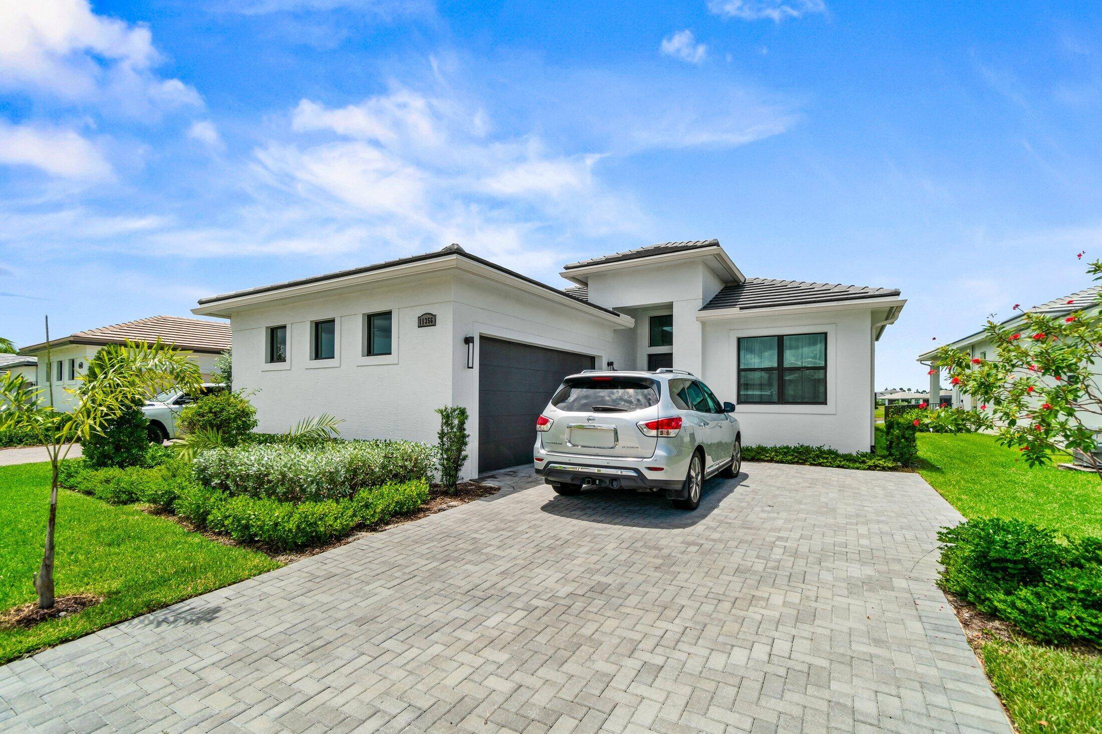 Stunning 3 Bedroom Office, 3 Bath Home with Lake Views in highly desirable PGA Verano.