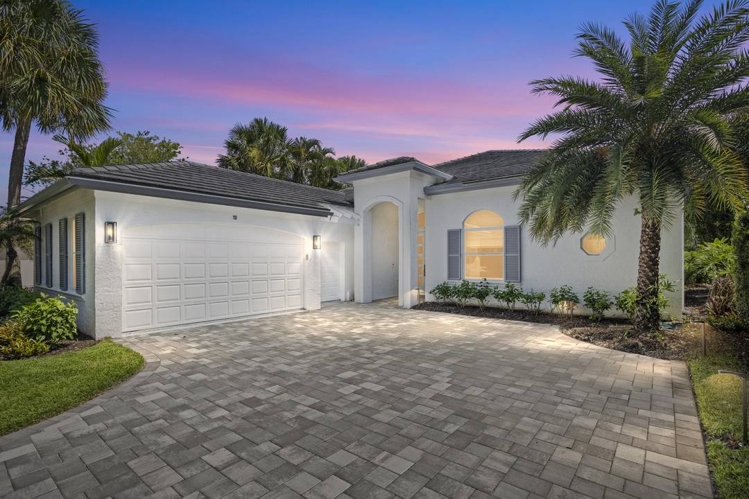 Experience elegant coastal living at 118 N Village Way, a turnkey gem nestled in Jupiter's exclusive Admirals Cove Golf Village.