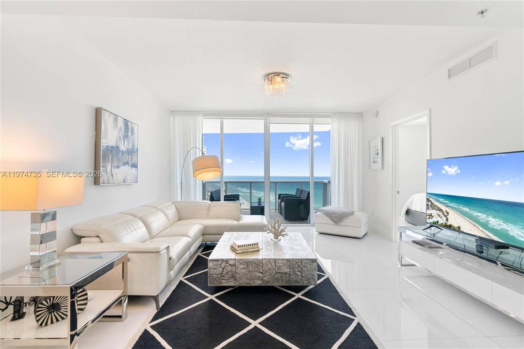 Stunning 2 bedroom, 2. 5 bath split floor plan with direct ocean views at Trump Royale.