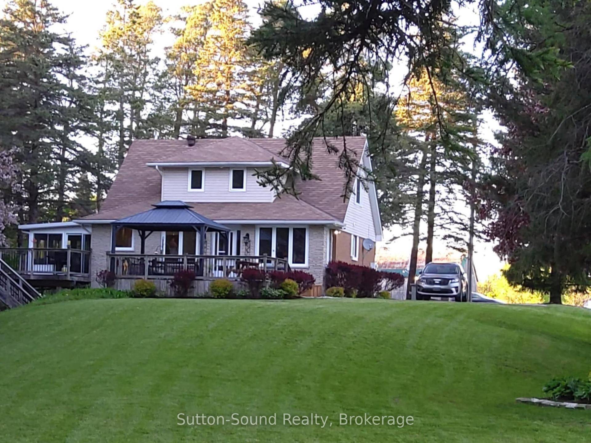 Welcome to this beautifully maintained Cape Cod style brick home, perfectly situated on a lush and private 1.