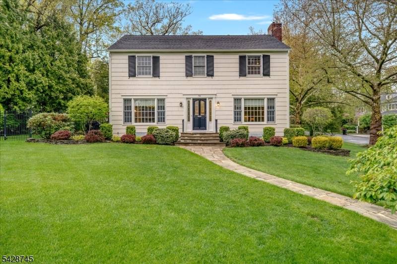 Gracefully set on a beautiful property in the Hartshorn section of Short Hills, this classic Center Hall Colonial blends timeless design with a warm, inviting feel.