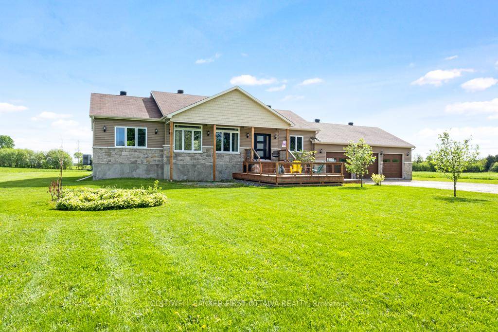 Enjoy sunrises and sunsets from this immaculate new 2022 bungalow on 1.
