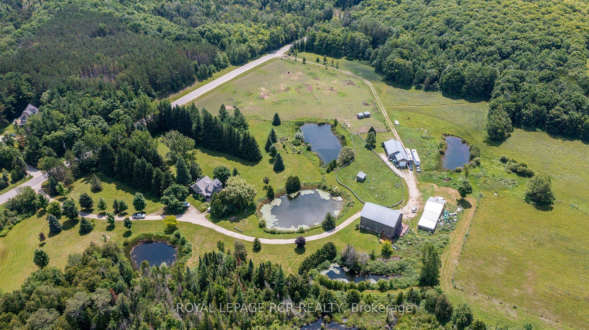 63 acres on a paved corner in Grey Highlands.