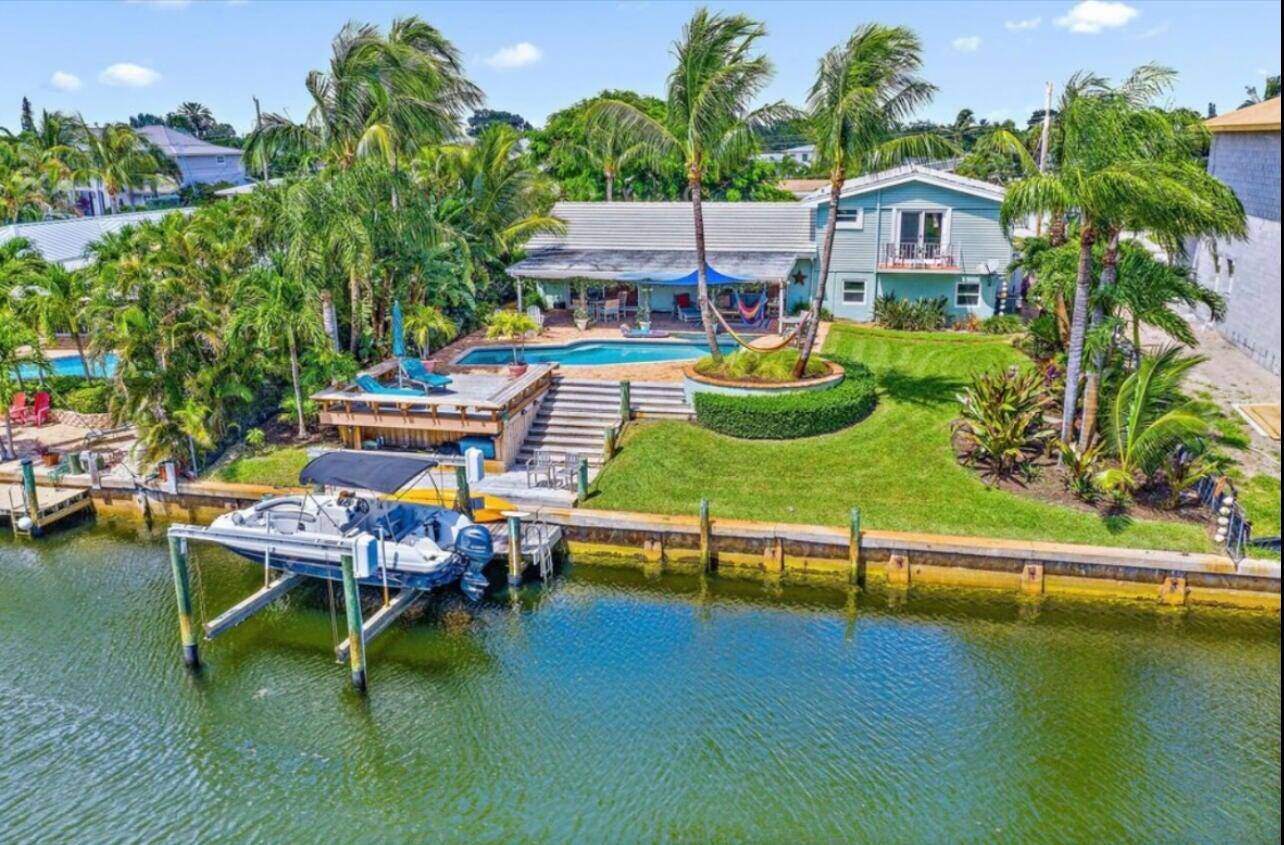 Stunning waterfront home is Florida paradise living at its finest !