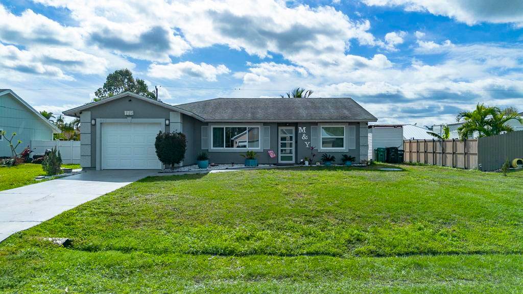 Experience refined living in this impeccably updated pool home in the heart of Port St.