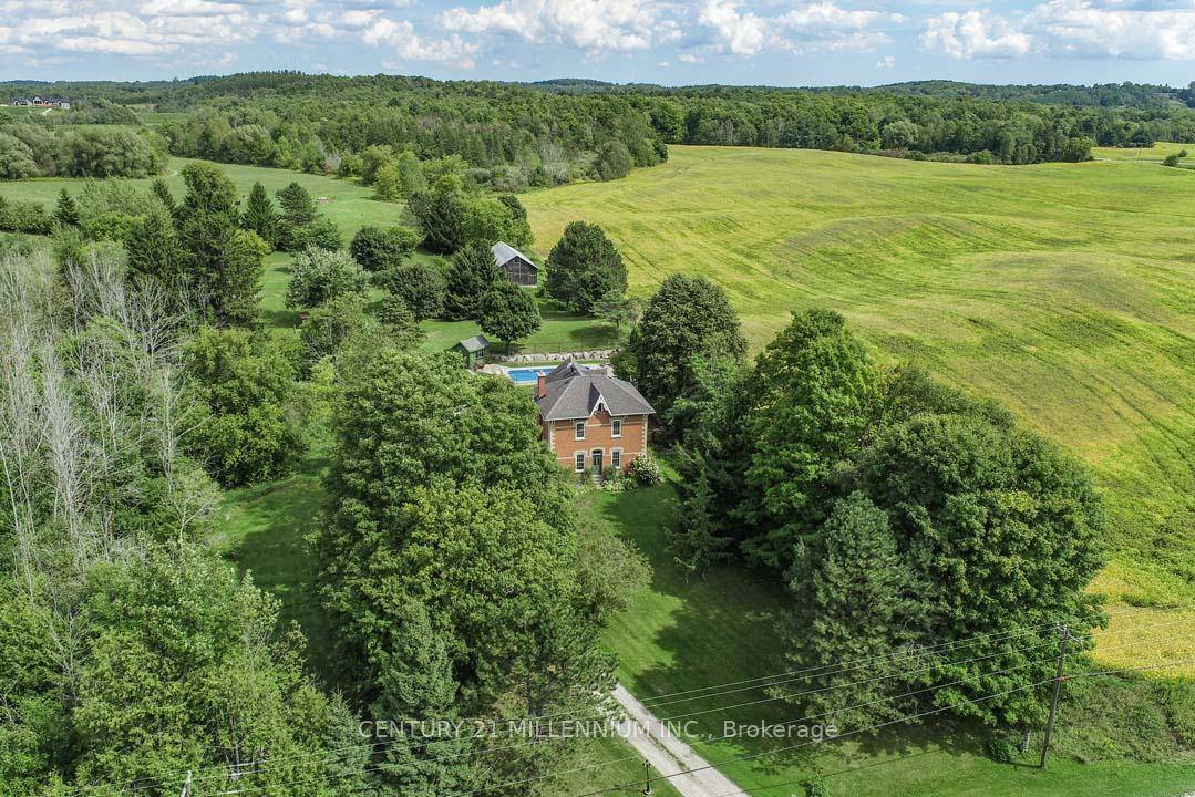 Located on a quiet rural country road, in a fantastic Southerly location close to town, this charming 4 bedroom, red brick Century home stately sits on 4.