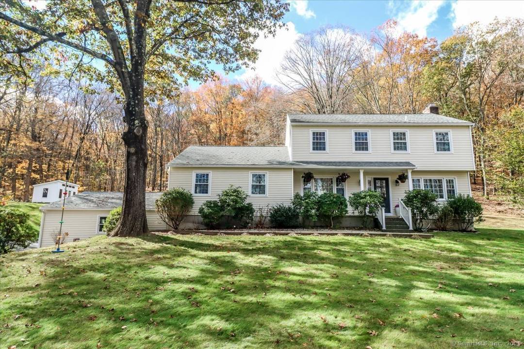 This spacious 5 bedroom Colonial, located in Bethel, CT, offers an updated open floor plan on 2.