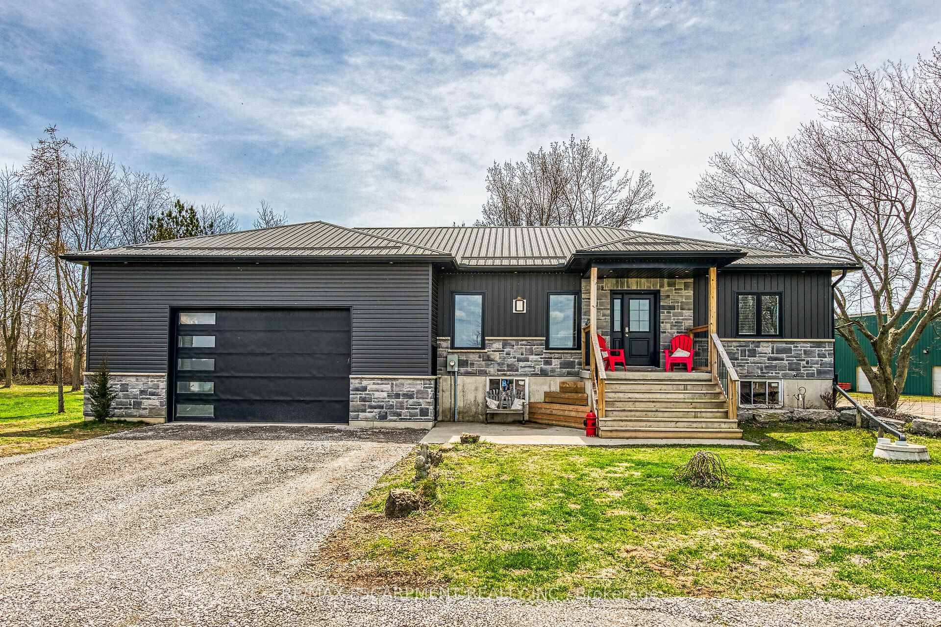 Beautifully presented, Custom Built 3 bedroom, 2 bathroom Bungalow with Irreplaceable 30 x 40 attached heated garage shop complete with custom bar area, hoist, 2 TVs, amp ; oversized 16 ...