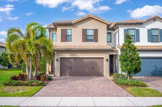 Welcome to this immaculate 3 bedroom, 2 bath townhouse situated in a serene, private community in Western Lake Worth.