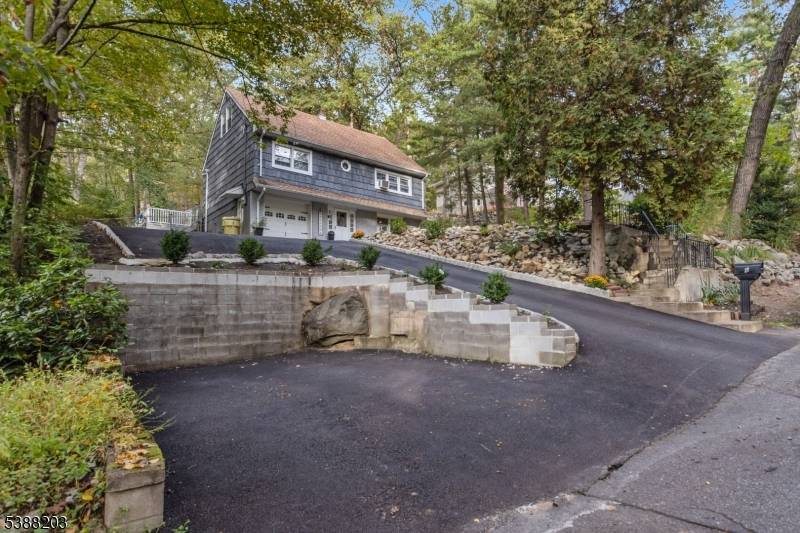 Beautifully renovated home located in a desirable lake community, featuring four spacious bedrooms and 2.