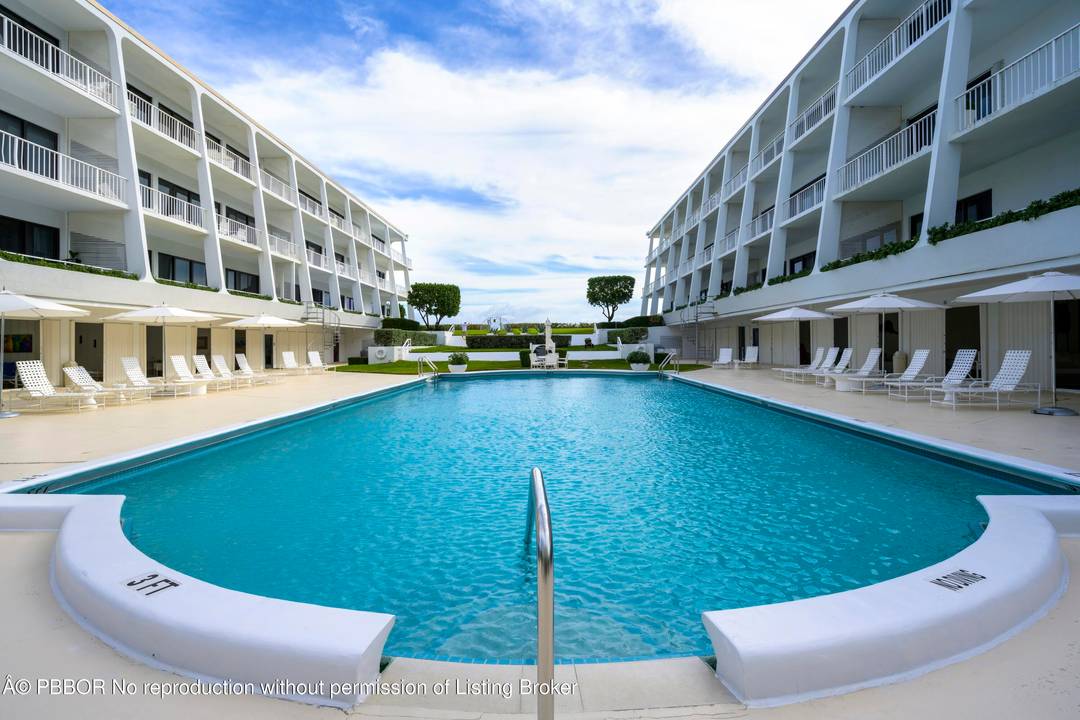 Completely renovated 2BR 2BA garden apartment in The Reef that truly lives like a private beach house, offering direct access to the pool and beach.