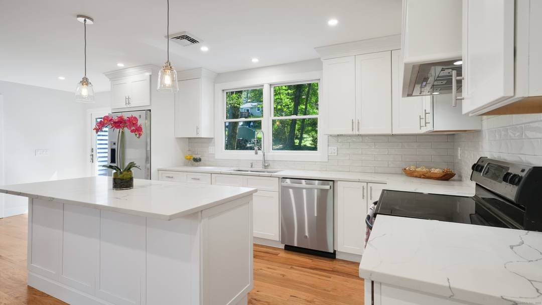 Welcome to this charming, renovated home located in the Candlewood Point neighborhood !