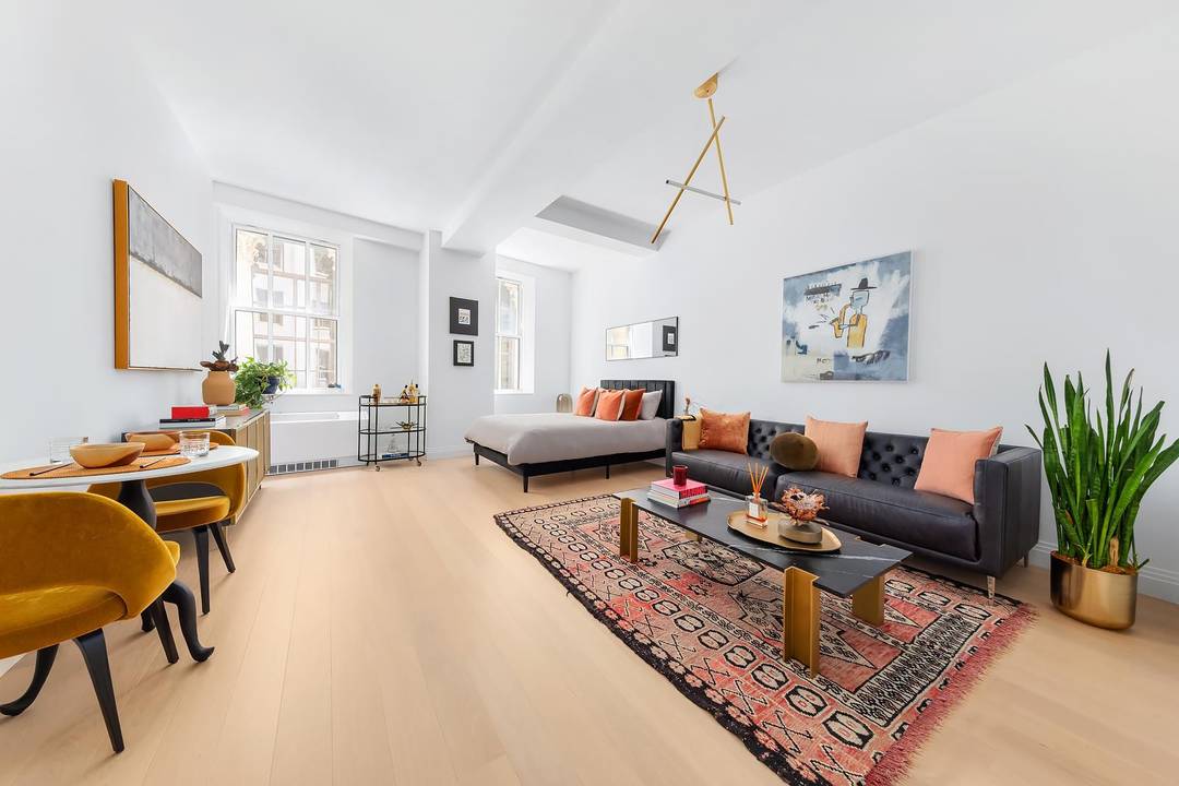 Move In Ready ! Residence 823 is an alcove studio with home office at One Wall Street.