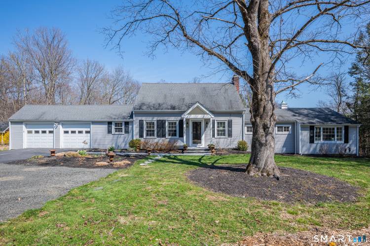 Charm abounds in this remodeled classic cape with 2 car garage, central air, and massive 1st floor master suite !