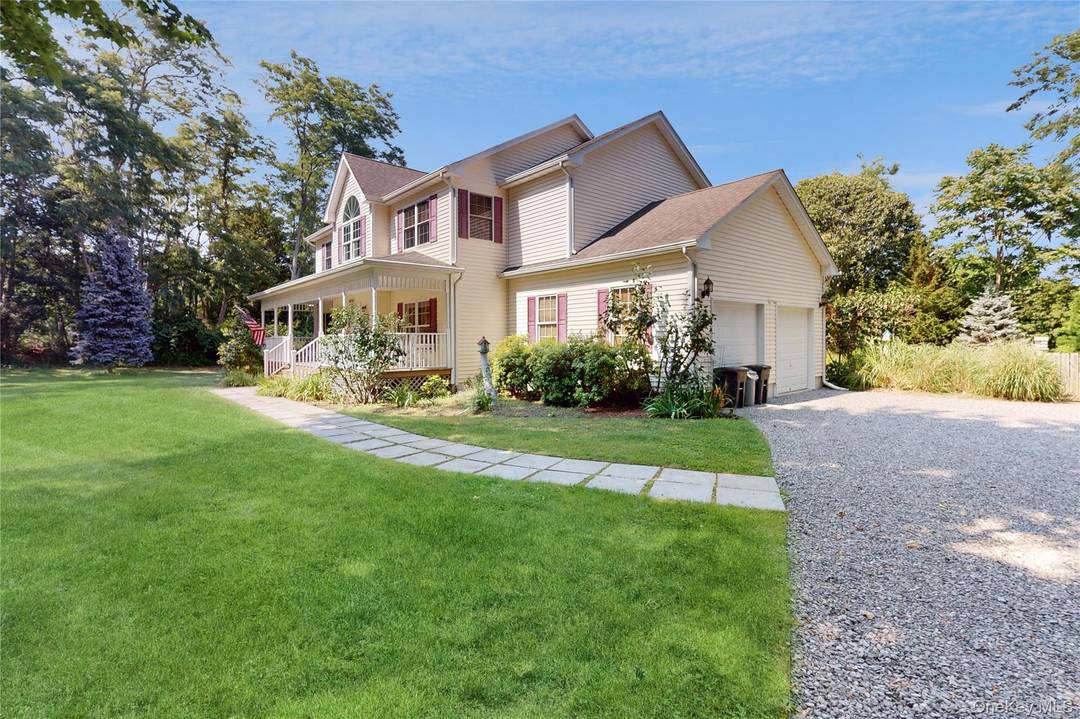 Enjoy summer fun on the North Fork in this MINT farmhouse on beautiful sprawling property !