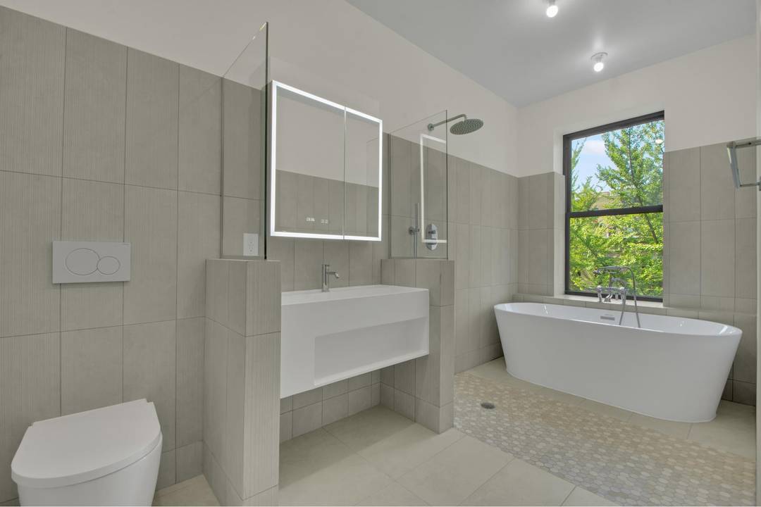 Welcome to an exquisite 1980 square foot duplex residence where timeless sophistication meets contemporary luxury.