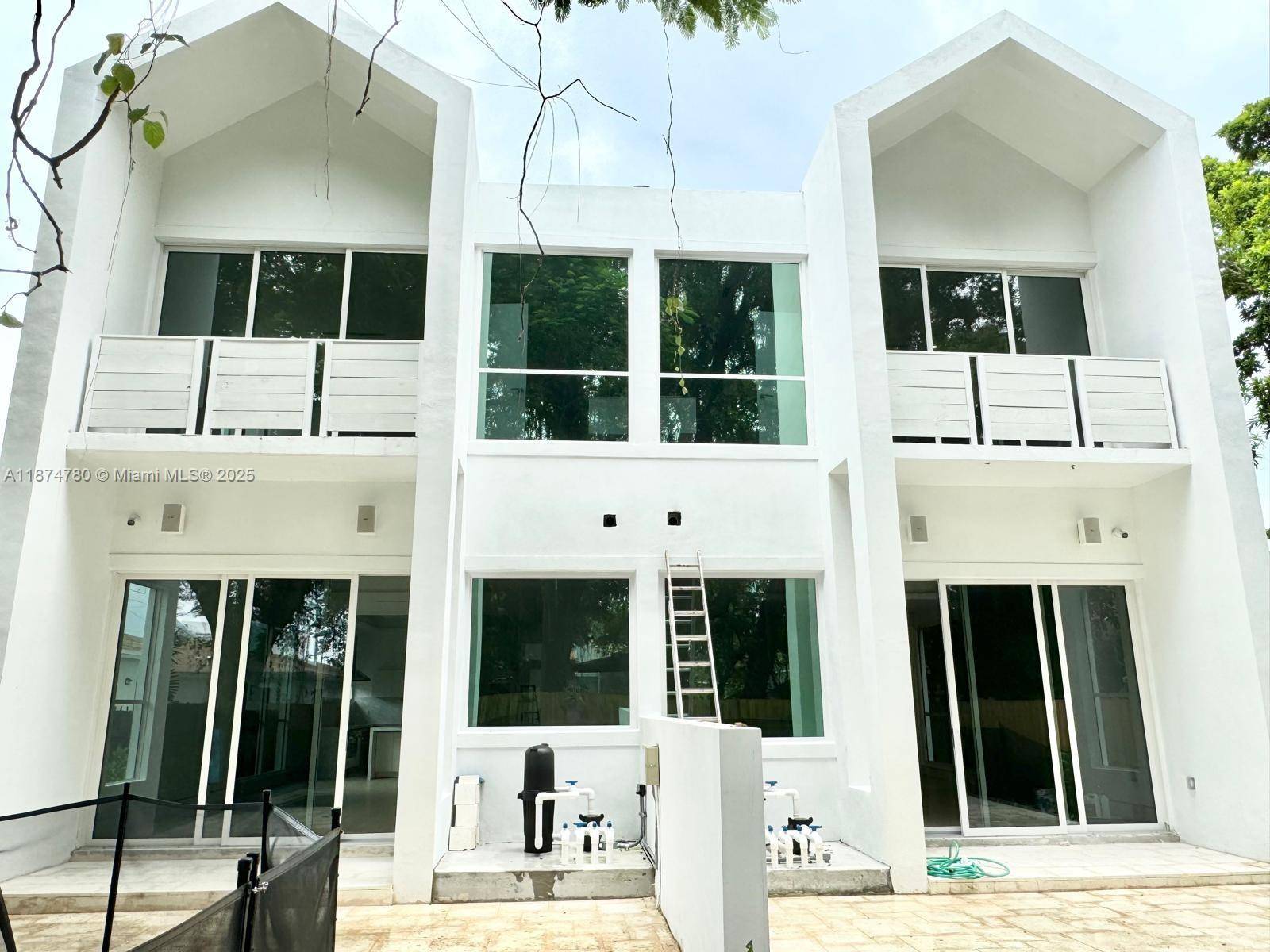 Now priced to sell. Experience modern Miami living in this stylish Buena Vista Gardens townhome featuring bright open spaces, soaring ceilings, and a sleek chef s kitchen with premium finishes.