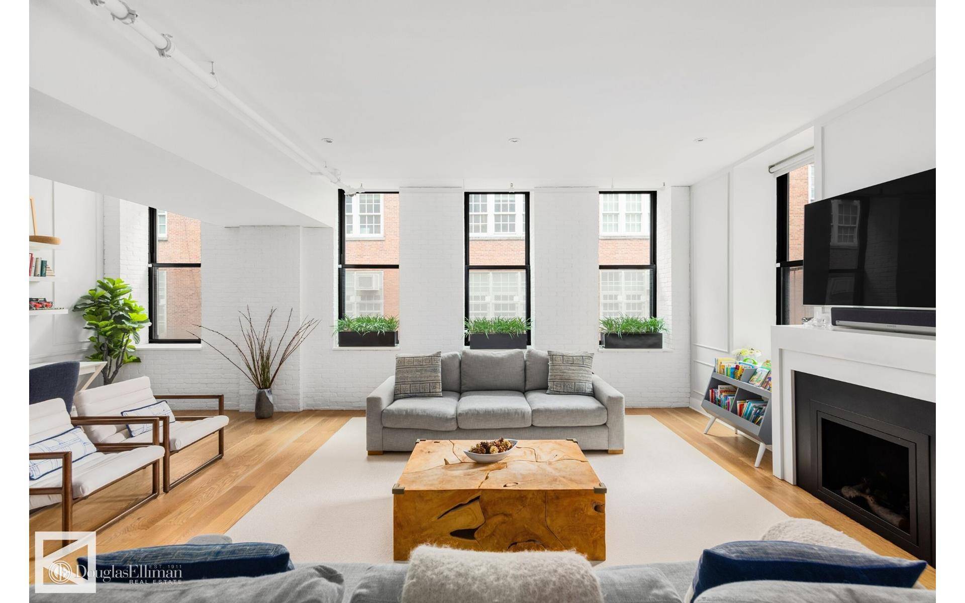 Situated on the coveted Mulberry Street in the heart of Nolita this unrivaled four bedroom, 3.