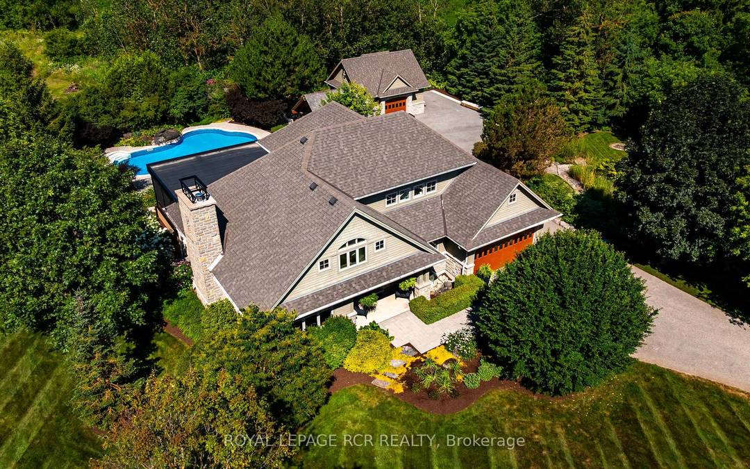 Set on 1. 33 acres of private, thoughtfully landscaped grounds, this custom built home is truly one of a kind.