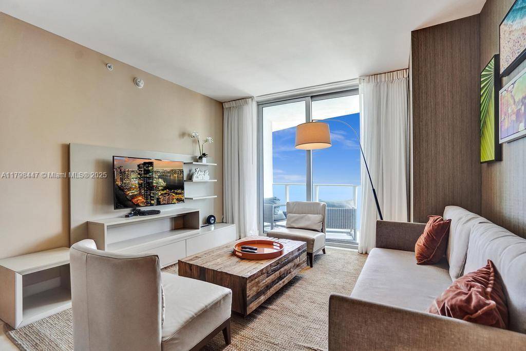 Ocean view luxury apartment located directly on the beach in a modern resort style building.