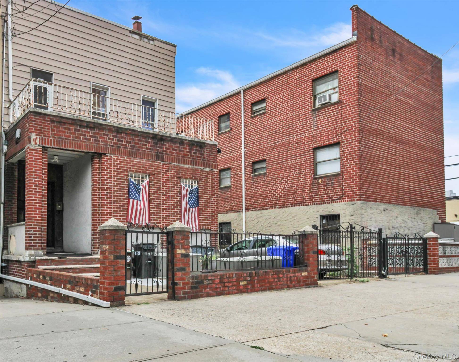 Legal 2 family in Astoria with private driveway and parking for 2 cars.