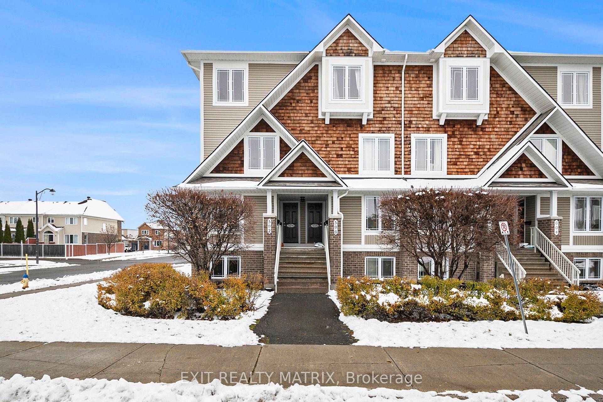 Welcome to 594 Lakeridge Drive, a bright and spacious upper level corner end unit stacked condo offering 2 bedrooms, 2.