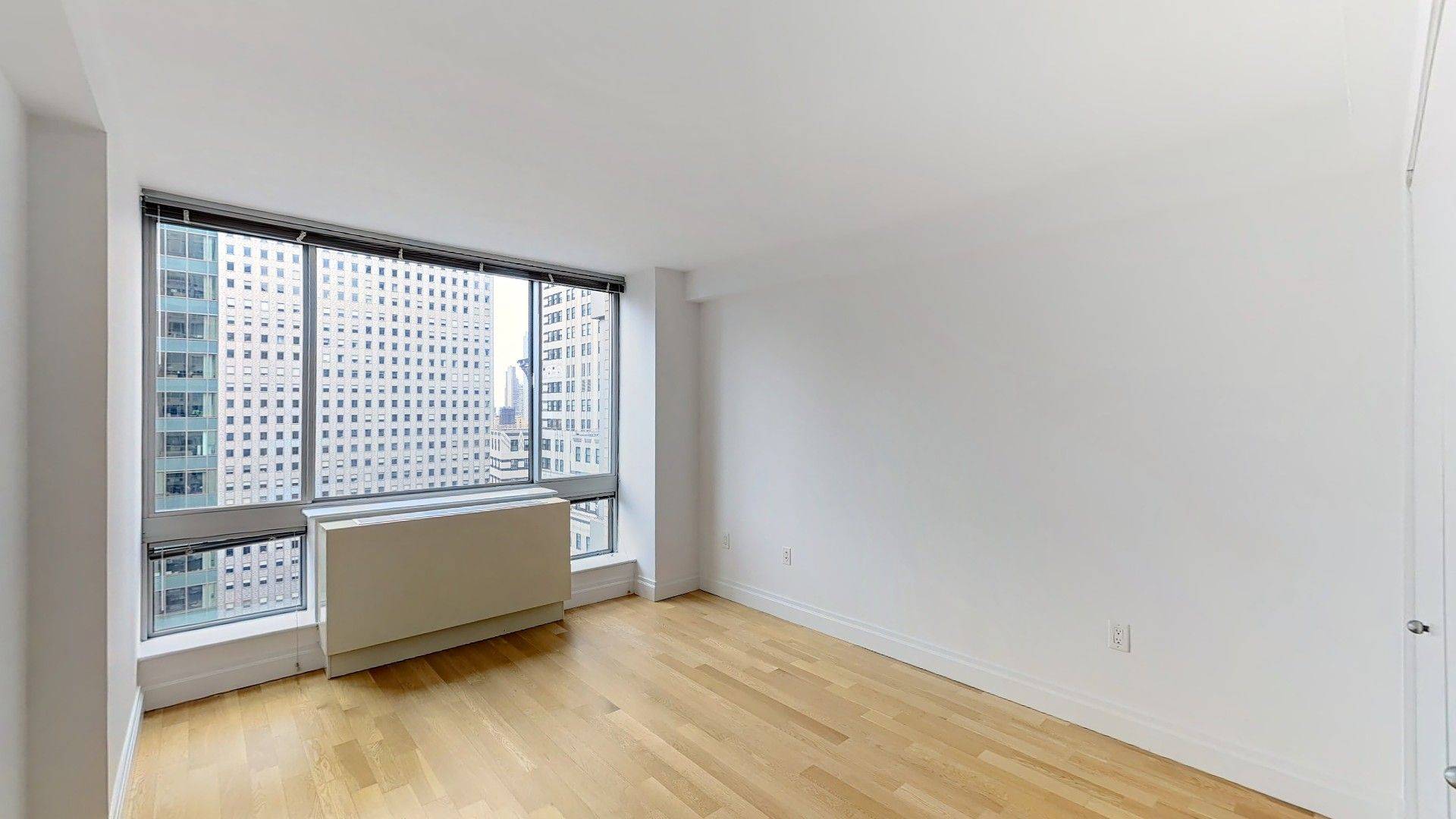 This corner 1BR 1BA unit has spectacular East River and southern views that overlook The Chrysler Building.